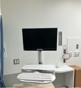 A monitor stand in a hospital room.