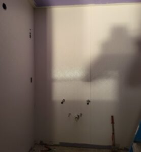 A shadow of a person on a wall.