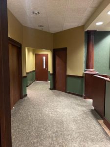 An empty hallway in a courtroom.