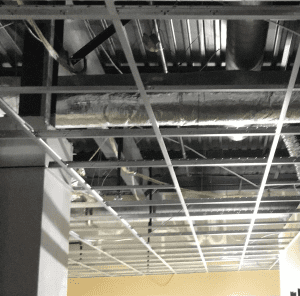 A black and white photo of a metal ceiling.