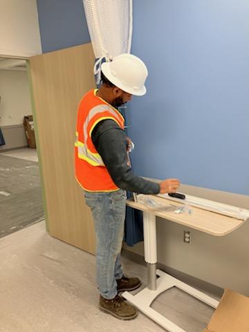Worker in safety gear at hospital site