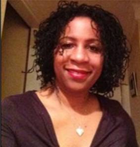 Portrait of a woman in a black top.