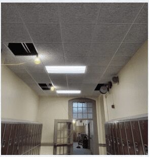School hallway with open ceiling panels