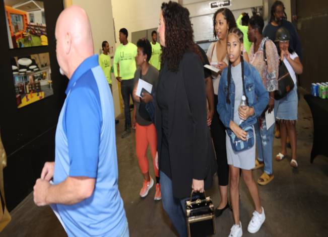 People exploring an indoor gallery