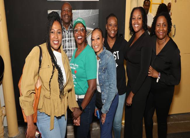 Group of people posing and smiling