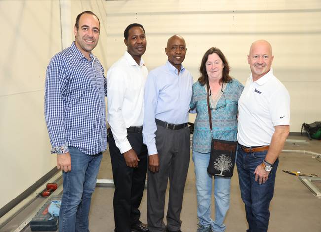 Diverse group posing in a room
